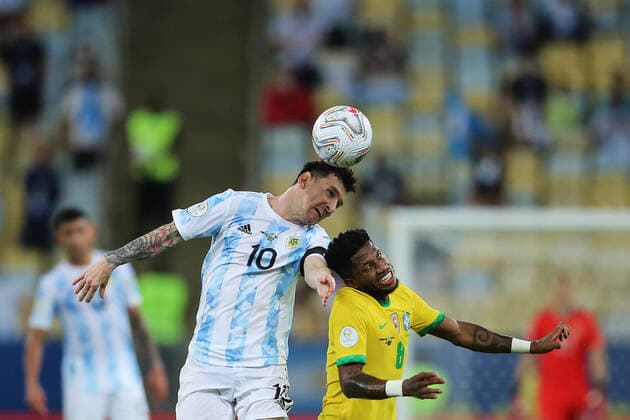 10th July 2021, Est& xe1;dio do Maracan& xe3;, Rio de Janeiro, Brazil. Copa America tournament final, Argentina versus Brazil; Lionel Messi of Argentina challenges Fred of Brazil for the high ball  ActionPlus12304515 HeulerxAndrey