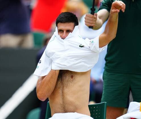 Mandatory Credit: Photo by Javier Garcia Shutterstock (12204578cr) Novak Djokovic changes his shirt during the Gentlemen s Singles final Wimbledon Tennis Championships, Day 13, The All England Lawn Tennis and Croquet Club, London, UK - 11 Jul 2021 Wimbledon Tennis Championships, Day 13, The All England Lawn Tennis and Croquet Club, London, UK - 11 Jul 2021  Copyright: xJavierxGarcia Shutterstockx 12204578cr
