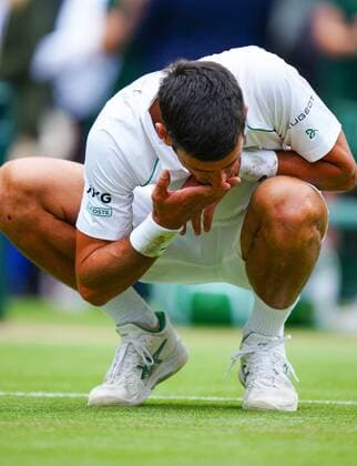 Mandatory Credit: Photo by Javier Garcia Shutterstock (12204578fq) Novak Djokovic celebrates victory in the Gentlemen s Singles final by eating some of the grass from the court Wimbledon Tennis Championships, Day 13, The All England Lawn Tennis and Croquet Club, London, UK - 11 Jul 2021 Wimbledon Tennis Championships, Day 13, The All England Lawn Tennis and Croquet Club, London, UK - 11 Jul 2021  Copyright: xJavierxGarcia Shutterstockx 12204578fq