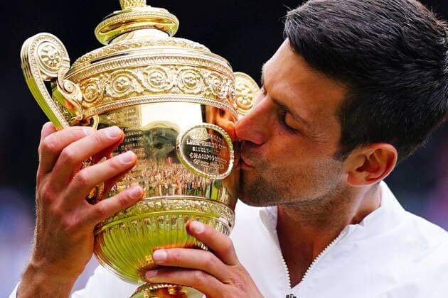Mandatory Credit: Photo by Javier Garcia Shutterstock (12204578gg) Novak Djokovic celebrates with the trophy after victory in the Gentlemen s Singles final Wimbledon Tennis Championships, Day 13, The All England Lawn Tennis and Croquet Club, London, UK - 11 Jul 2021 Wimbledon Tennis Championships, Day 13, The All England Lawn Tennis and Croquet Club, London, UK - 11 Jul 2021  Copyright: xJavierxGarcia Shutterstockx 12204578gg