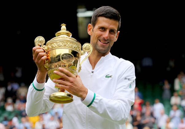 Mandatory Credit: Photo by Shutterstock (12204580ap) Novak Djokovic of Serbia celebrates with the trophy Wimbledon Tennis Championships, Day 13, The All England Lawn Tennis and Croquet Club, London, UK - 11 Jul 2021 Wimbledon Tennis Championships, Day 13, The All England Lawn Tennis and Croquet Club, London, UK - 11 Jul 2021  Copyright: xShutterstockx 12204580ap