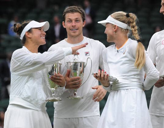 Lawn Tennis - 2021 All England Championships - Men™s Final Sunday - Wimbledon - Mixed Doubles Final on Centre Court. Neal Skupski and Desirae Krawczyk v Joe Salisbury and Harriet Dart Neal Skupski and Desirae Krawczyk share a joke with Harriet Dart 