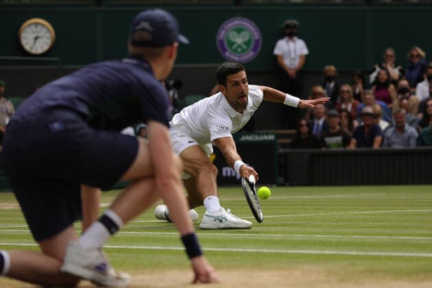 (210712) -- LONDON, July 12, 2021 -- Novak Djokovic (R) of Serbia hits a return during the men s final match between Novak Djokovic of Serbia and Matteo Berrettini of Italy at Wimbledon tennis Championship in London, Britain, on July 11, 2021. (Photo by Xinhua) (SP)BRITAIN-LONDON-TENNIS-WIMBLEDON-MEN S FINAL TimxIreland 