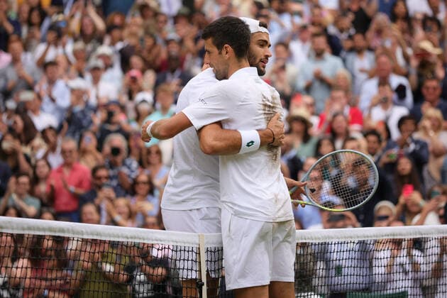 (210712) -- LONDON, July 12, 2021 -- Novak Djokovic (R) of Serbia hugs Matteo Berrettini of Italy after the men s final match between Novak Djokovic of Serbia and Matteo Berrettini of Italy at Wimbledon tennis Championship in London, Britain, on July 11, 2021. (Photo by Xinhua) (SP)BRITAIN-LONDON-TENNIS-WIMBLEDON-MEN S FINAL TimxIreland 