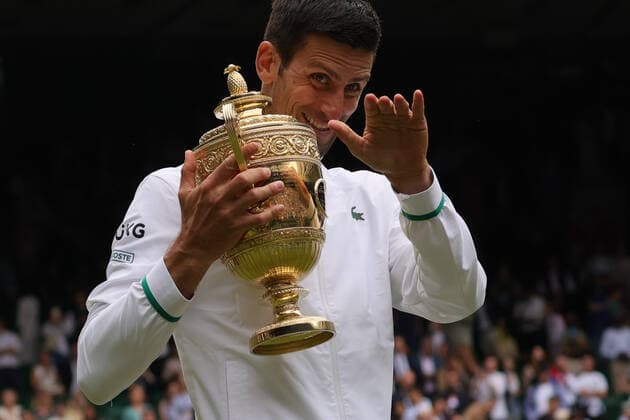 (210712) -- LONDON, July 12, 2021 -- Novak Djokovic of Serbia celebrates with the trophy after winning the men s final match between Novak Djokovic of Serbia and Matteo Berrettini of Italy at Wimbledon tennis Championship in London, Britain, on July 11, 2021. (Photo by Xinhua) (SP)BRITAIN-LONDON-TENNIS-WIMBLEDON-MEN S FINAL TimxIreland 