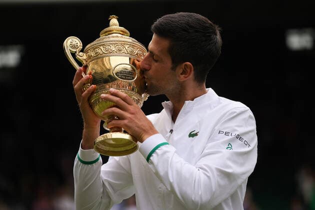 (210712) -- LONDON, July 12, 2021 -- Novak Djokovic of Serbia celebrates with the trophy after winning the men s final match between Novak Djokovic of Serbia and Matteo Berrettini of Italy at Wimbledon tennis Championship in London, Britain, on July 11, 2021. (Photo by Xinhua) (SP)BRITAIN-LONDON-TENNIS-WIMBLEDON-MEN S FINAL TimxIreland 