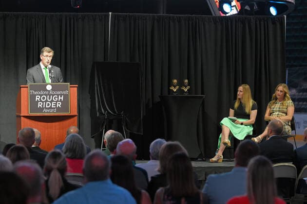 July 14, 2021: University of North Dakota president Andrew Armacost addresses the crowd before North Dakota Governor Doug Burgum presents the state s highest honor, the Theodore Roosevelt Rough Rider Award to olympic gold medalists Monique Lamoureux-Morando (left) and twin sister Jocelyne Lamoureux-Davidson (right) during a ceremony at the Ralph Engelstad Arena, Grand Forks, ND. CSM Grand Forks USA - ZUMAc04_ 20210714_zaf_c04_008 Copyright: xRussellxHonsx