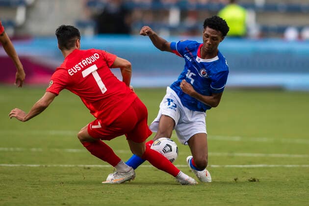 KANSAS CITY, KS - JULY 15: Haiti midfielder Dutherson Clerveaux (15) attempts to sidestep Canada midfielder Stephen Eustaquio (7) during the CONCACAF Gold Cup match between Canada and Haiti on Thursday July 15, 2021 at ChildrenÕs Mercy Park in Kansas City, KS. (Photo by Nick Tre. Smith Icon Sportswire) SOCCER: JUL 15 Concacaf Gold Cup - Haiti v Canada Icon21071532