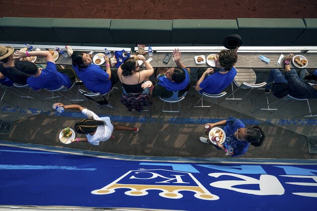 Fans eat before the Kansas City Royals and the Baltimore Orioles at Kaufman Stadium in Kansas City, Missouri on Friday, July 16, 2021.  KCP20210716105 KYLExRIVAS