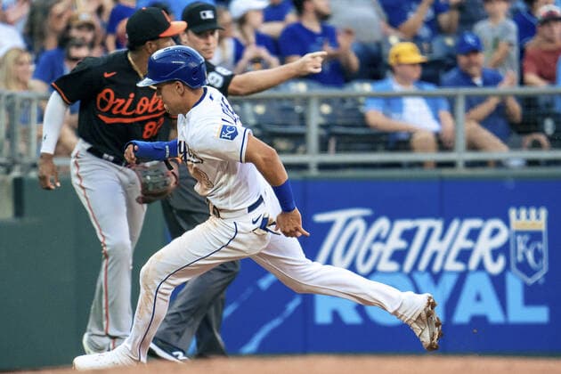 Kansas City Royals second baseman Nicky Lopez (8) rounds third and scores against the Baltimore Orioles in the third inning at Kaufman Stadium in Kansas City, Missouri on Friday, July 16, 2021.  KCP20210716117 KYLExRIVAS
