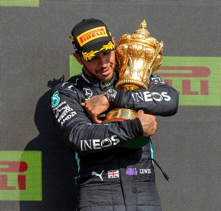 18th July 2021; Silverstone Circuit, Silverstone, Northamptonshire, England; Formula One British Grand Prix, Race Day; Race winner Mercedes AMG Petronas F1 Team driver Lewis Hamilton hugs the winners trophy  ActionPlus12307242 TimxWilliams