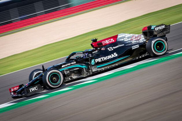 18th July 2021; Silverstone Circuit, Silverstone, Northamptonshire, England; Formula One British Grand Prix, Race Day; Race winner Mercedes AMG Petronas F1 Team driver Lewis Hamilton in his Mercedes F1 W12 Mercedes AMG F1 M12 powerrs through Club corner  ActionPlus12307266 TimxWilliams