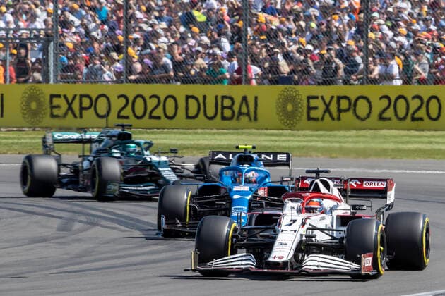 18th July 2021; Silverstone Circuit, Silverstone, Northamptonshire, England; Formula One British Grand Prix, Race Day; Alfa Romeo Racing Orlen driver Kimi Raikkonen in his Alfa Romeo C41 Ferrari 065 6 leads from Alpine F1 Team driver Esteban Ocon in his Alpine A521 Renault E-Tech 20B and Aston Martin Cognizant F1 Team driver Lance Stroll in his Aston Martin AMR21 Mercedes-AMG F1 M12  ActionPlus12307283 TimxWilliams