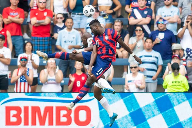 KANSAS CITY, KS - JULY 18: United States forward Daryl Dike (11) heads the ball over Canada defender Kamal Miller (4) during the group B final match between the United States and Canada on Sunday July 18, 2021 at Children™s Mercy Park in Kansas City, KS. (Photo by Nick Tre. Smith Icon Sportswire) SOCCER: JUL 18 Concacaf Gold Cup - USA v Canada Icon2107180047