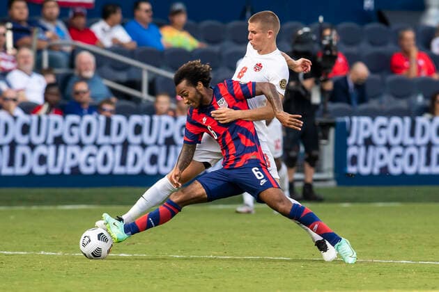 KANSAS CITY, KS - JULY 18: United States midfielder Gianluca Busio (6) shields the ball away from Canada midfielder Liam Fraser (8) during the group B final match between the United States and Canada on Sunday July 18, 2021 at Children™s Mercy Park in Kansas City, KS. (Photo by Nick Tre. Smith Icon Sportswire) SOCCER: JUL 18 Concacaf Gold Cup - USA v Canada Icon2107180073