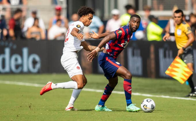 KANSAS CITY, KS - JULY 18: United States defender Shaq Moore (20) looks to maneuver around a defender during the group B final match between the United States and Canada on Sunday July 18, 2021 at Children™s Mercy Park in Kansas City, KS. (Photo by Nick Tre. Smith Icon Sportswire) SOCCER: JUL 18 Concacaf Gold Cup - USA v Canada Icon2107180141