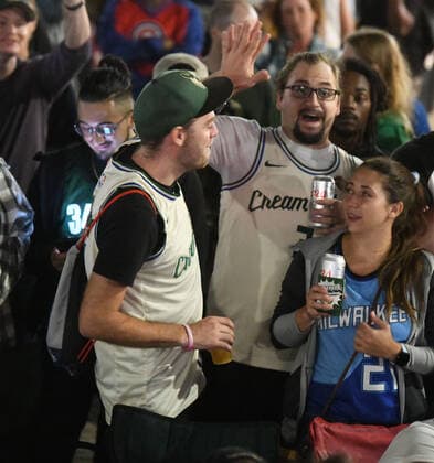 July 20, 2021, Racine, Wisconsin, USA: Fans cheer as a crowd estimated at up to 1,000 people watches the final minutes of the Milwaukee Bucks 105-98 victory over the Phoenix Suns to win the NBA, Basketball Herren, USA Championship at the â€oeDeer District Downtown†in Racine, Wisconsin Tuesday July 20, 2021. It was their first championship in 50 years. The â€oeDeer District Downtown,†modeled after the Deer District outside the Bucks arena in Milwaukee, enabled fans to gather on Monument Square in the middle of downtown and watch the game on large screen TVs. Racine USA - ZUMAh154 20210720_znp_h154_002 Copyright: xMarkxHertzbergx