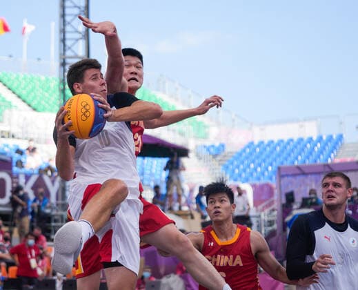 (210724) -- TOKYO, July 24, 2021 -- Kirill Pisklov (1st L) of the ROC lays up under the defense of Hu Jinqiu (2nd L) of China during the men s 3x3 basketball pool round match between China and the Russian Olympic Committee (ROC) in Tokyo, Japan, July 24, 2021. ) (TOKYO2020)JAPAN-TOKYO-OLY-3X3 BASKETBALL-MEN S POOL ROUND ZhangxXiaoyu 