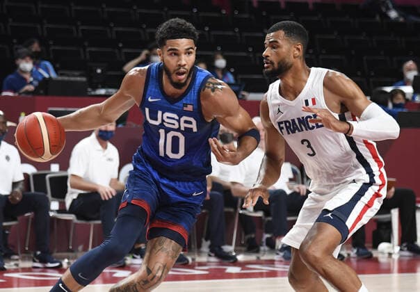 The United States Jayson Tatum (10) drives to the basket as he defended by France s Timothe Luwawu Kongbo during a Men s Basketball game at the Tokyo 2020 Olympics, Sunday, July 25, 2021, in Tokyo, Japan.  OLY20210725895 MIKExTHEILER