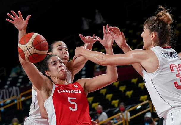 July 26, 2021, Tokyo, Japan: Team Canada guard Kia Nurse (5) battles for the loose ball against Team Serbia centre Tina Krajisnik (33) and forward Sonja Vasic (5) during first half Olympic basketball action at the Tokyo Olympics in Tokyo, Japan on Monday, July 26, 2021. Canada News - July 26, 2021  - ZUMAc35_ 20210726_zaf_c35_021 Copyright: xNathanxDenettex