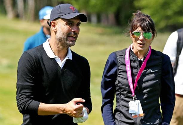 Mandatory Credit: Photo by James Marsh BPI Shutterstock (9690131al) Manchester City Manager Pep Guardiola speaks with his wife during his round. BMW PGA, Golf Herren Championship Pro Am, Wentworth Club, Virginia Water, Surrey, UK - 23 May 2018 BMW PGA Championship Pro Am, Wentworth Club, Virginia Water, Surrey, UK - 23 May 2018  Copyright: xJamesxMarsh BPI Shutterstockx 9690131al