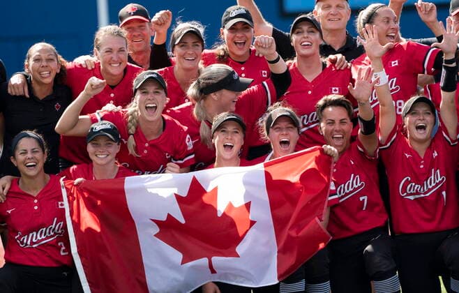 July 27, 2021, Yokohama, Japan: CanadaÃ¢â‚¬â ¢s womenÃ¢â‚¬â ¢s softball team pose for a photo with the Canadian flag after their win over Mexico in the bronze medal game at the Tokyo Olympics, Tuesday, July 27, 2021 in Yokohama, Japan. Canada News - July 27, 2021  - ZUMAc35_ 20210727_zaf_c35_026 Copyright: xThexCanadianxPressx