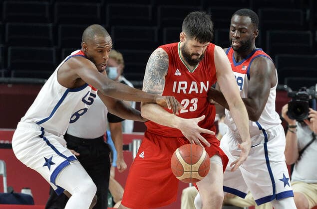Iran s Aaron Geramipoor (23) has the ball stripped from his grasp by United States Khris Middleton (L) as teammate Draymond Green watches during a Men s Basketball game at the Tokyo 2020 Olympics, Wednesday, July 28, 2021, in Tokyo, Japan. The USA won easily, 120-66.  OLY20210728815 MIKExTHEILER