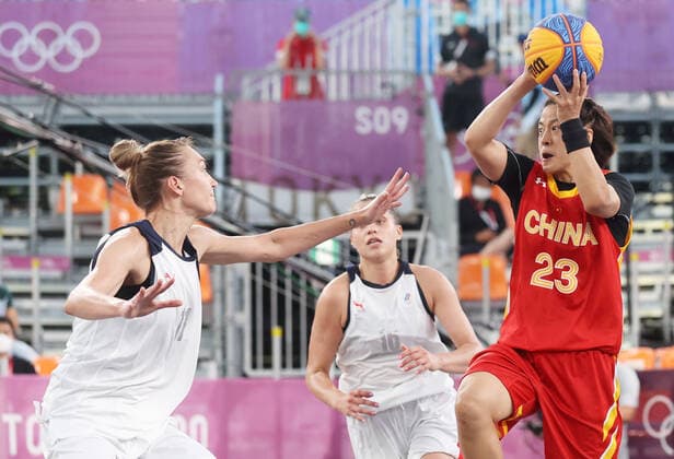 TOKYO, JAPAN - JULY 28, 2021: ROC s Anastasia Logunova, Yevgenia Frolkina defend against China s Wang Lili (L-R) in their women s 3x3 basketball semifinal match during the Tokyo 2020 Summer Olympic Games, Olympische Spiele, Olympia, OS at the Aomi Urban Sports Park. Stanislav Krasilnikov TASS  TS109FF2