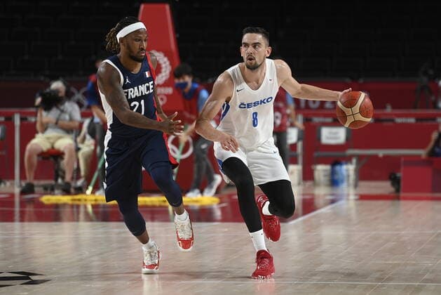 From left Andrew Albicy of France and Czech Tomas Satoransky in action during the basketball Group A match Czech Republic vs. France in Tokyo 2020 Summer Olympics, Japan, July 28, 2021. (CTKxPhoto OndrejxDeml) CTKPhotoP2021072811467  dml