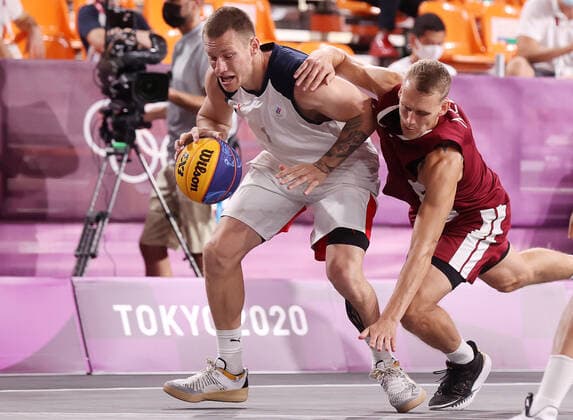 TOKYO, JAPAN - JULY 28, 2021: ROC s Stanislav Sharov (L) and Latvia s Nauris Miezis in action in their men s 3x3 basketball gold medal match during the Tokyo 2020 Summer Olympic Games, Olympische Spiele, Olympia, OS at the Aomi Urban Sports Park. Stanislav Krasilnikov TASS  TS10A0EA