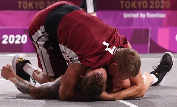 TOKYO, JAPAN - JULY 28, 2021: Latvia s players celebrate after winning their men s 3x3 basketball gold medal match against the ROC Team during the Tokyo 2020 Summer Olympic Games, Olympische Spiele, Olympia, OS at the Aomi Urban Sports Park. Stanislav Krasilnikov TASS  TS10A102