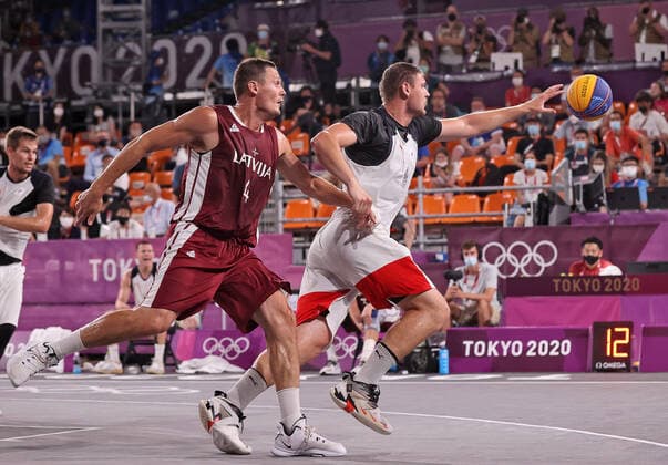 TOKYO, JAPAN - JULY 28, 2021: Latvia s Agnis Cavars (L) and ROC s Ilya Karpenkov in action in their men s 3x3 basketball gold medal match during the Tokyo 2020 Summer Olympic Games, Olympische Spiele, Olympia, OS at the Aomi Urban Sports Park. Stanislav Krasilnikov TASS  TS10A186