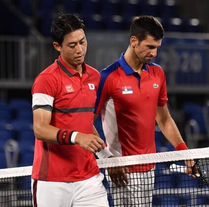 Tokyo Olympics: Tennis Serbia s Novak Djokovic (R) and Japan s Kei Nishikori are pictured after their Tokyo Olympic tennis singles quarterfinal match at Ariake Tennis Park on July 29, 2021. Djokovic won 6-2, 6-0.  A14AA0000755080P