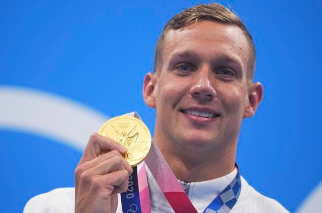(210729) -- TOKYO, July 29, 2021 -- Caeleb Dressel of the United States displays the gold medal on the awarding ceremony of the men s 100m freestyle of swimming at Tokyo 2020 Olympic Games, Olympische Spiele, Olympia, OS in Tokyo, Japan, July 29, 2021. ) (TOKYO2020)JAPAN-TOKYO-OLY-SWIMMING-MEN S 100M FREESTYLE-AWARDING CEREMONY XuxChang 