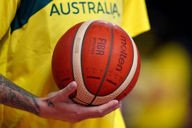 OLY21 BASKETBALL WOMENS AUST CHINA, A member of the Australian team coaching staff holds ball during the warm up, ahead of the Women s Preliminaries Group C Basketball match between China and Australia at the Saitama Super Arena during the Tokyo Olympic Games, Olympische Spiele, Olympia, OS in Tokyo, Japan Friday, July 30, 2021. ( NO ARCHIVING, EDITORIAL USE ONLY, NO USE IN BOOKS WITHOUT CONSENT TOKYO JAPAN Copyright: xJOExGIDDENSx 20210730001562105119