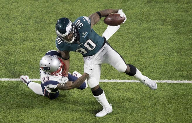 Mandatory Credit: Photo by Dave Shopland BPI Shutterstock (9351501bb) Corey Clement, Philadelphia Eagles Running Back, (30) catches the ball as Patrick Chung, New England Patriots Safety, (23) goes in for the tackle in the second quarter. Super Bowl LII Super Bowl LII  Copyright: xDavexShopland BPI Shutterstockx 9351501bb