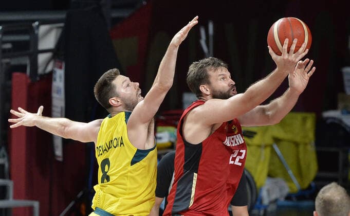 Germany s Danilo Barthel drives to the basket as Australia s Matthew Dellavedova defends during Men s Basketball game at the Tokyo 2020 Olympics, Saturday, July 31, 2021, in Tokyo, Japan. Australia defeated Germany 89-76.  OLY20210731818 MIKExTHEILER