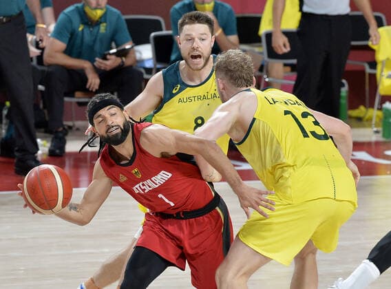 Germany s Joshiko Saibou (1) is pressured by Australia s Jock Landale (13) and Matthew Dellavedova during Men s Basketball game at the Tokyo 2020 Olympics, Saturday, July 31, 2021, in Tokyo, Japan. Australia defeated Germany 89-76.  OLY20210731819 MIKExTHEILER