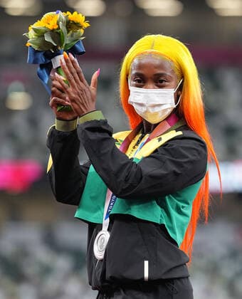 (210801) -- TOKYO, Aug. 1, 2021 -- Shelly-Ann Fraser-Pryce of Jamaica reacts during the awarding ceremony of the Women s 100m at the Tokyo 2020 Olympic Games, Olympische Spiele, Olympia, OS in Tokyo, Japan, Aug. 1, 2021. ) (TOKYO2020)JAPAN-TOKYO-OLY-ATHLETICS-WOMEN S 100M-AWARDING CEREMONY JuxHuanzong 