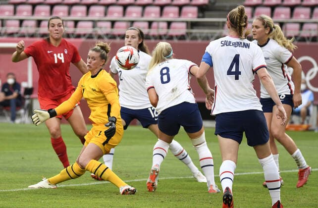 United States Goalie Alyssa Naeher (L) lands awkwardly on her ankle making a save on goal, as teammates (L-r) Crystal Dunn, Julie Ertz and Becky Sauerbrunn look on against Canada s Vanessa Gilles (14) during Women s Soccer semi-final match at the Tokyo 2020 Olympics, Monday, August 2, 2021, in Kashima, Japan.  OLY20210802801 MIKExTHEILER