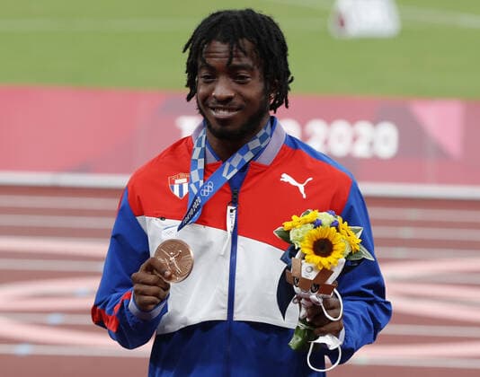 Bronze medalist Maykel Masso of Cuba stands on the podium at the awards ceremony for the Men s Long Jump at Olympic Stadium during the 2020 Summer Olympics in Tokyo, Japan on Sunday, August 2, 2021.  OLY20210802462 TASOSxKATOPODIS