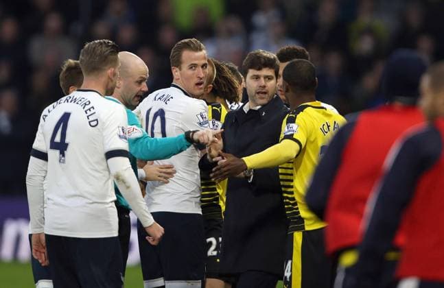 Mandatory Credit: Photo by Shutterstock (5502434p) Harry Kane of Spurs with Mauricio Pochettino, Manager of Tottenham and Idion Ighalo of Watford involved on the half way line. Watford FC vs Tottenham Hotspur, Barclays Premier League, Football, Vicarage Road, Watford, Britain - 28 Dec 2015 Editorial use only. No merchandising. For Football images FA and Premier League restrictions apply inc. no internet mobile usage without FAPL license - for details contact Football Dataco Watford FC vs Tottenham Hotspur, Barclays Premier League, Football, Vicarage Road, Watford, Britain - 28 Dec 2015 Editorial use only. No merchandising. For Football images FA and Premier League restrictions apply inc. no internet mobile usage without FAPL license - for details contact Football Dataco Copyright: xShutterstockx 5502434p