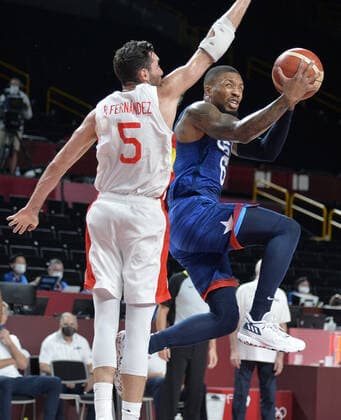 United States Damian Lillard goes under Spain s Rudy Fernandez to the basket during Men s Basketball quarterfinal game at the Tokyo 2020 Olympics, Tuesday, August 3, 2021, in Tokyo, Japan. USA won 95-81 to advance to the semi-final round.  OLY20210803807 MIKExTHEILER