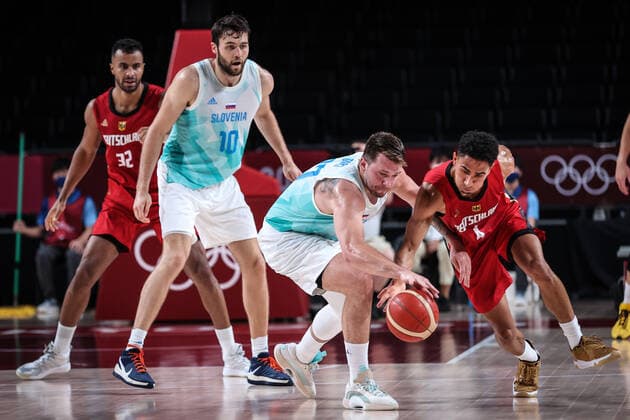 (210803) -- SAITAMA, Aug. 3, 2021 -- Luka Doncic (2nd R) of Slovenia competes with Maodo Lo (1st R) of Germany during the men s basketball quarterfinal match between Slovenia and Germany at Tokyo 2020 Olympic Games, Olympische Spiele, Olympia, OS in Saitama, Japan, Aug. 3, 2021. ) (TOKYO2020)JAPAN-SAITAMA-OLY-BASKETBALL-MEN S QUARTERFINAL-SLO VS GER PanxYulong 