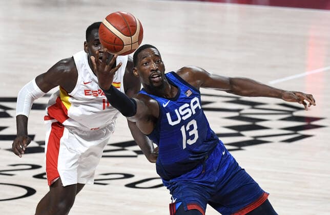United States Bam Adebayo reaches for a loose ball against Spain s Usman Garuba during Men s Basketball quarterfinal game at the Tokyo 2020 Olympics, Tuesday, August 3, 2021, in Tokyo, Japan. USA won, 95-81 to advance to the semi-finals.  OLY20210803817 MIKExTHEILER