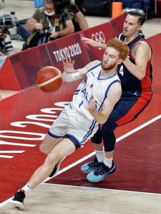 Italy s Nico Mannion receives the in bounds ball in front of France s Thomas Heurtel during the Men s Basketball quarterfinal game at the Tokyo 2020 Olympics on Tuesday, August 3, 2021 in Tokyo, Japan.  OLY20210803818 MIKExTHEILER