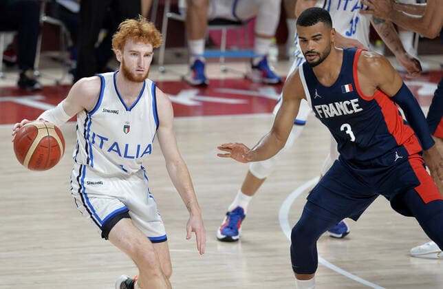 Italy s Nico Mannion dribbles the ball as France s Timothe Luwawu Cabarrot defends during the Men s Basketball quarterfinal game at the Tokyo 2020 Olympics, Tuesday, August 3, 2021, in Tokyo, Japan.  OLY20210803822 MIKExTHEILER
