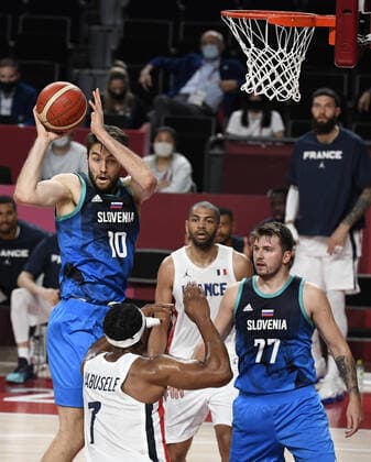Slovenia s Mike Tobey (10) rebounds over France s Guerschon Yabusele (7) as teammate Luka Doncic looks on during Men s Basketball semifinal at the Tokyo 2020 Olympics, Thursday, August 5, 2021, in Tokyo, Japan.  OLY20210805820 MIKExTHEILER