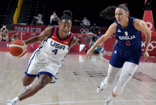 United States Jewell Loyd (4) dribbles downcourt defended by Serbia s Sasa Cado during the Women s Basketball semifinal at the Tokyo 2020 Olympics, Friday, August 6, 2021, in Tokyo, Japan. USA won, 70-59 to advance to the Gold Medal game.  OLY20210806806 MIKExTHEILER