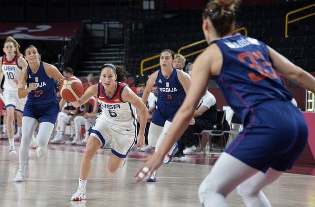 United States Sue Bird (C) dribbles downcourt as Serbia s Tina Krajisnik (R) defends during the Women s Basketball semifinal at the Tokyo 2020 Olympics, Friday, August 6, 2021, in Tokyo, Japan. USA won, 70-59 to advance to the Gold Medal game.  OLY20210806808 MIKExTHEILER